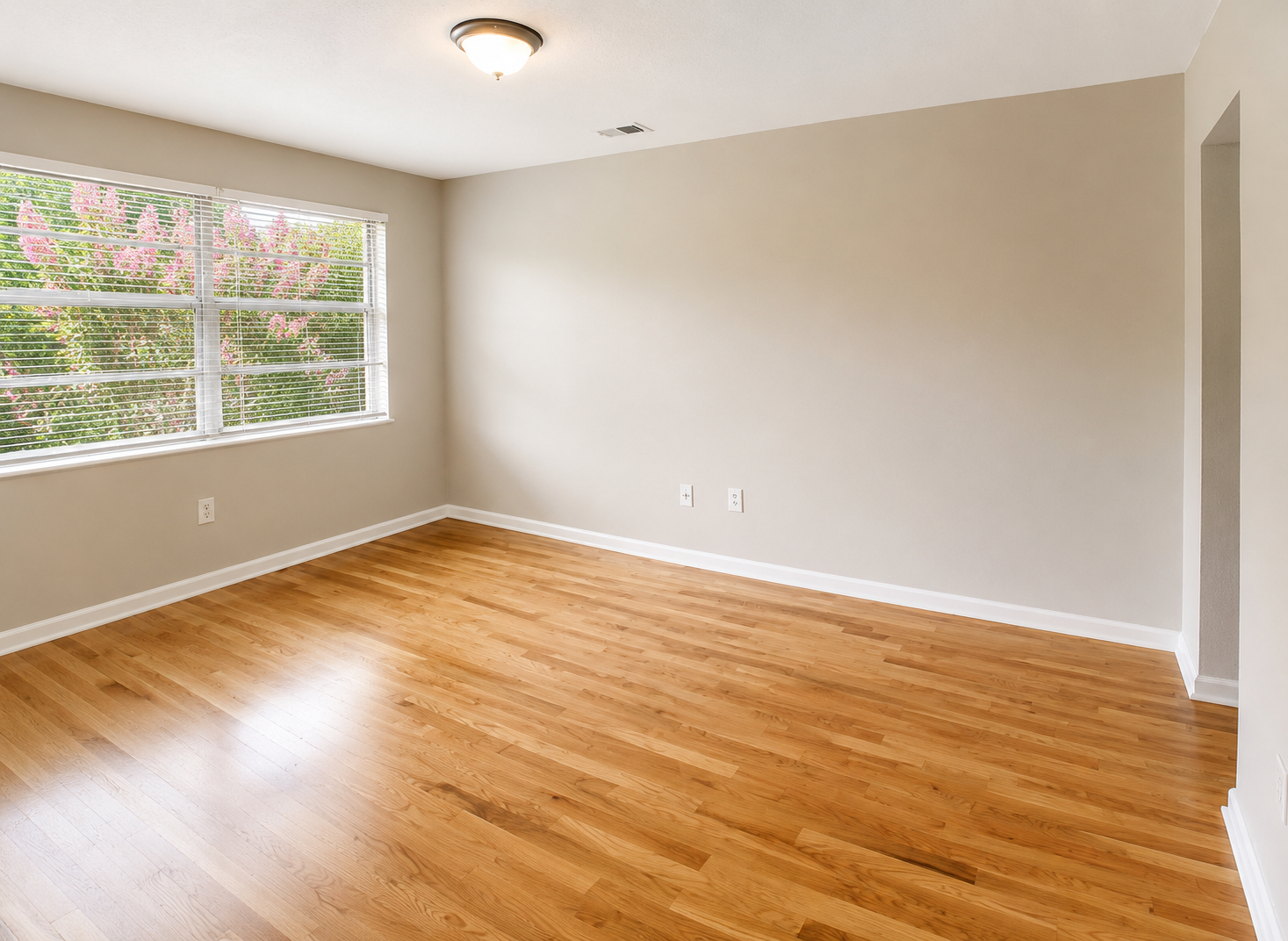 Urban Star Apartments bedroom with hardwood floors and natural light